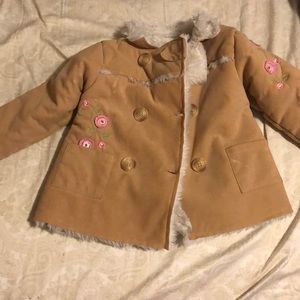Tan faux fur lined child’s jacket